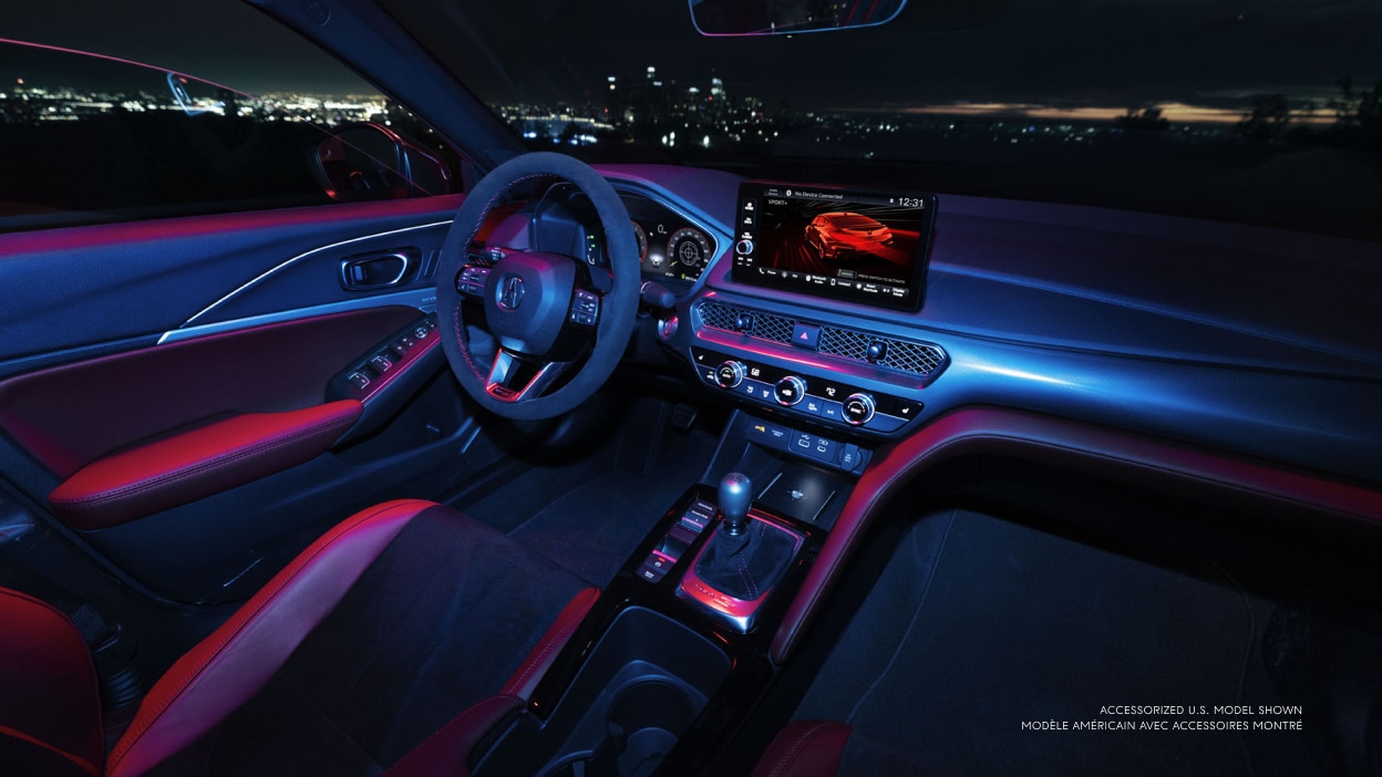 3/4 wide view of the interior of the cockpit of the Integra Type S at night.